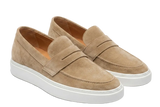 Pair of tan loafers with white soles on a light gray background