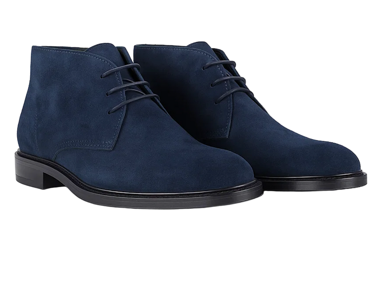 Pair of elevated blue suede shoes on a white background
